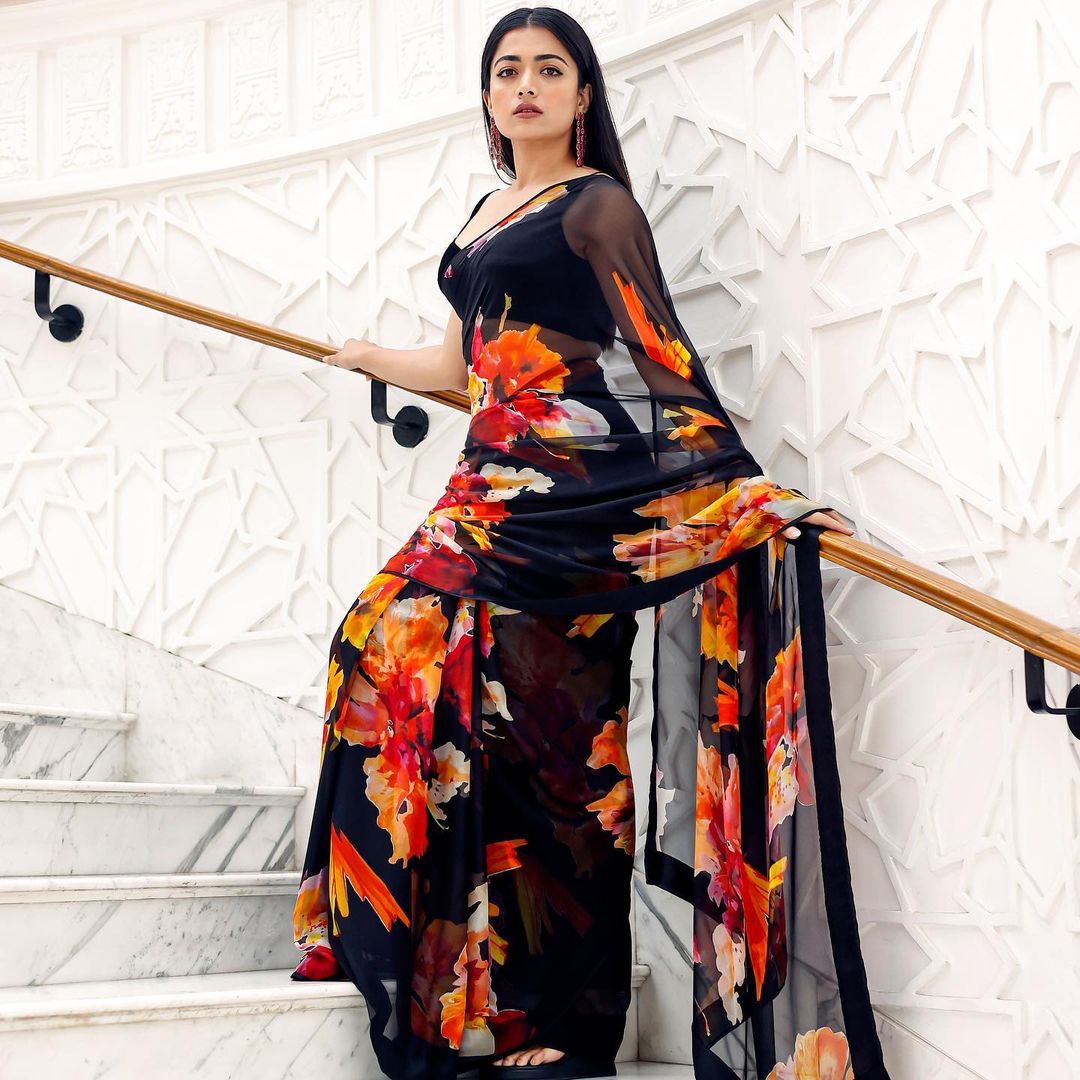 Model wearing black georgette printed saree with blouse from AmarVastra

