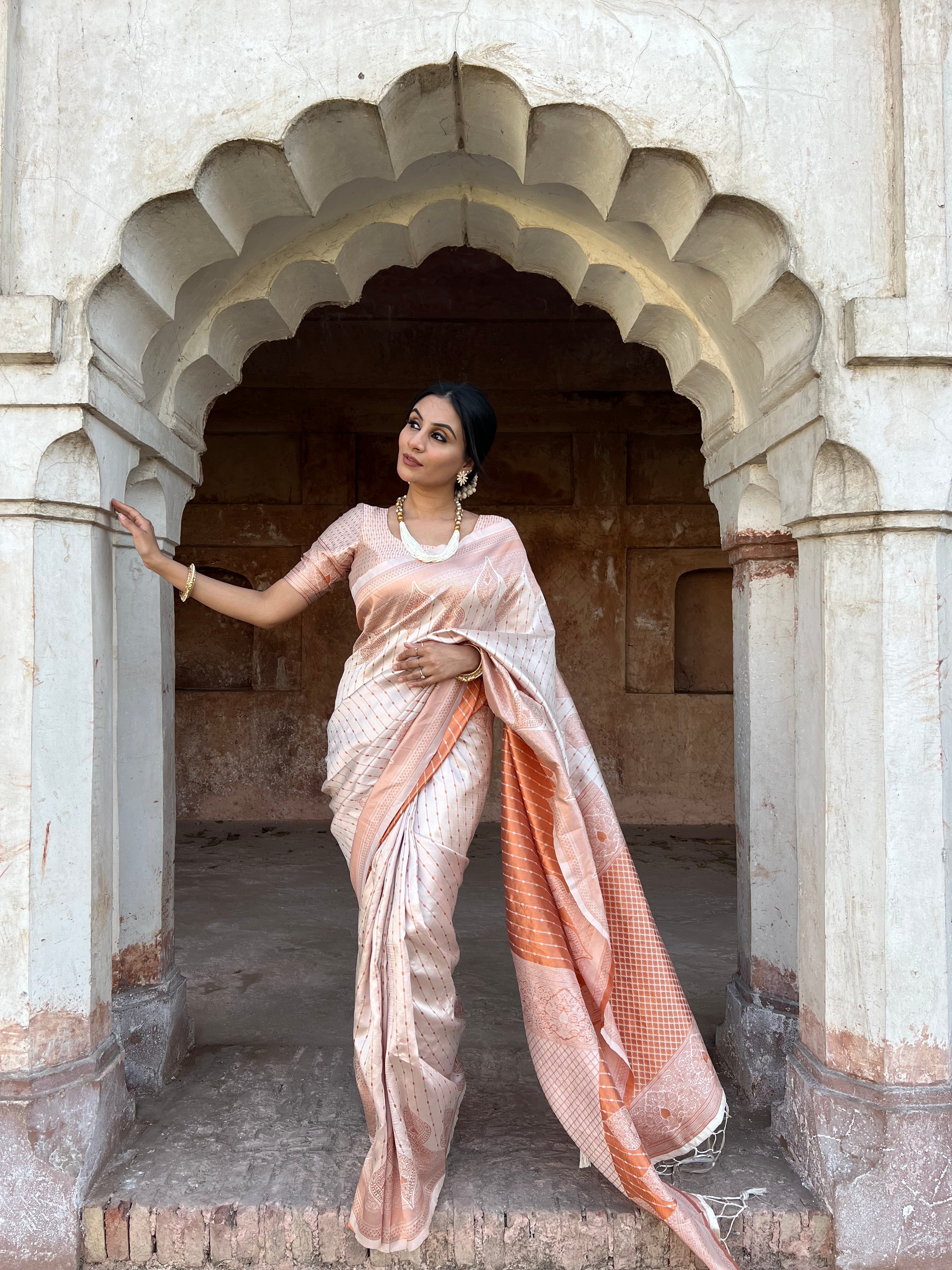 Glittering Off White Soft Silk Saree With Tempting Blouse Piece