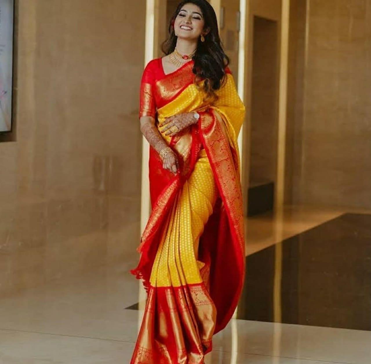 Pleasing Yellow Banarasi Silk Saree With Striking Blouse Piece