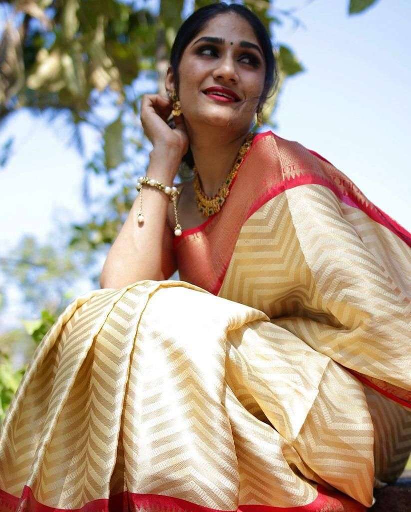 Aesthetic Cream Soft Silk Saree With Gratifying Blouse Piece