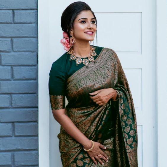 Hypnotic Dark Green Banarasi Silk Saree With Stylish Blouse Piece