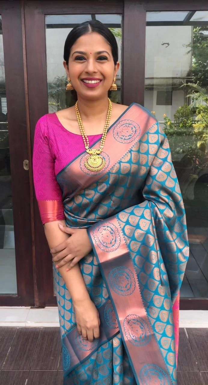 Innovative Firozi Banarasi Silk Saree With Extraordinary Blouse Piece