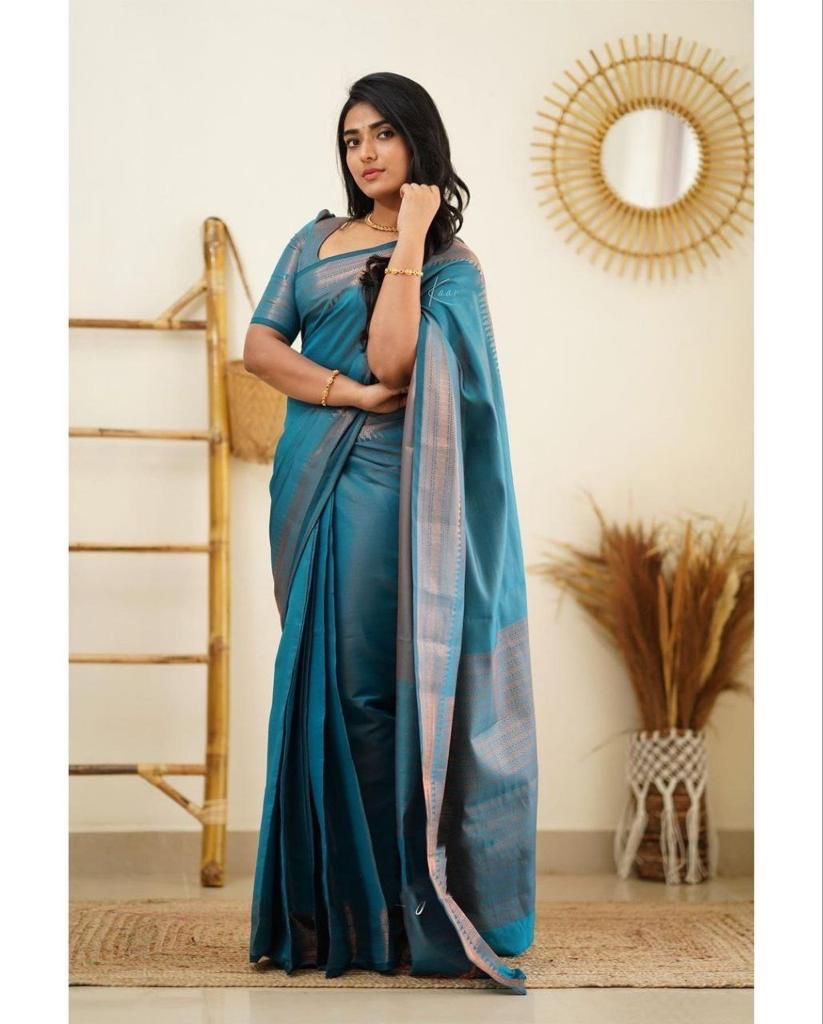 Surreptitious Firozi Soft Silk Saree With Exuberant Blouse Piece