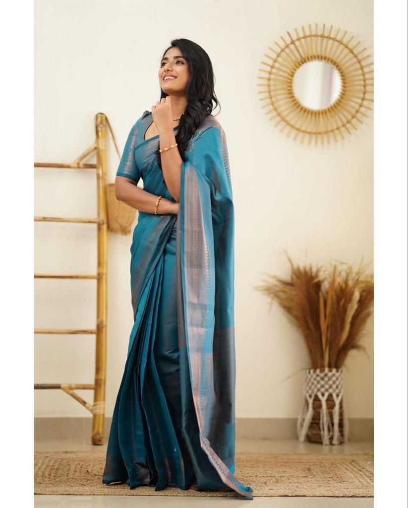 Surreptitious Firozi Soft Silk Saree With Exuberant Blouse Piece