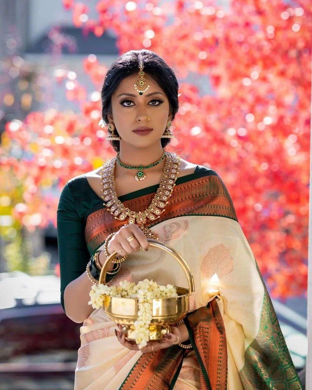 Enchanting Cream Banarasi Silk Saree With Polished Blouse Piece