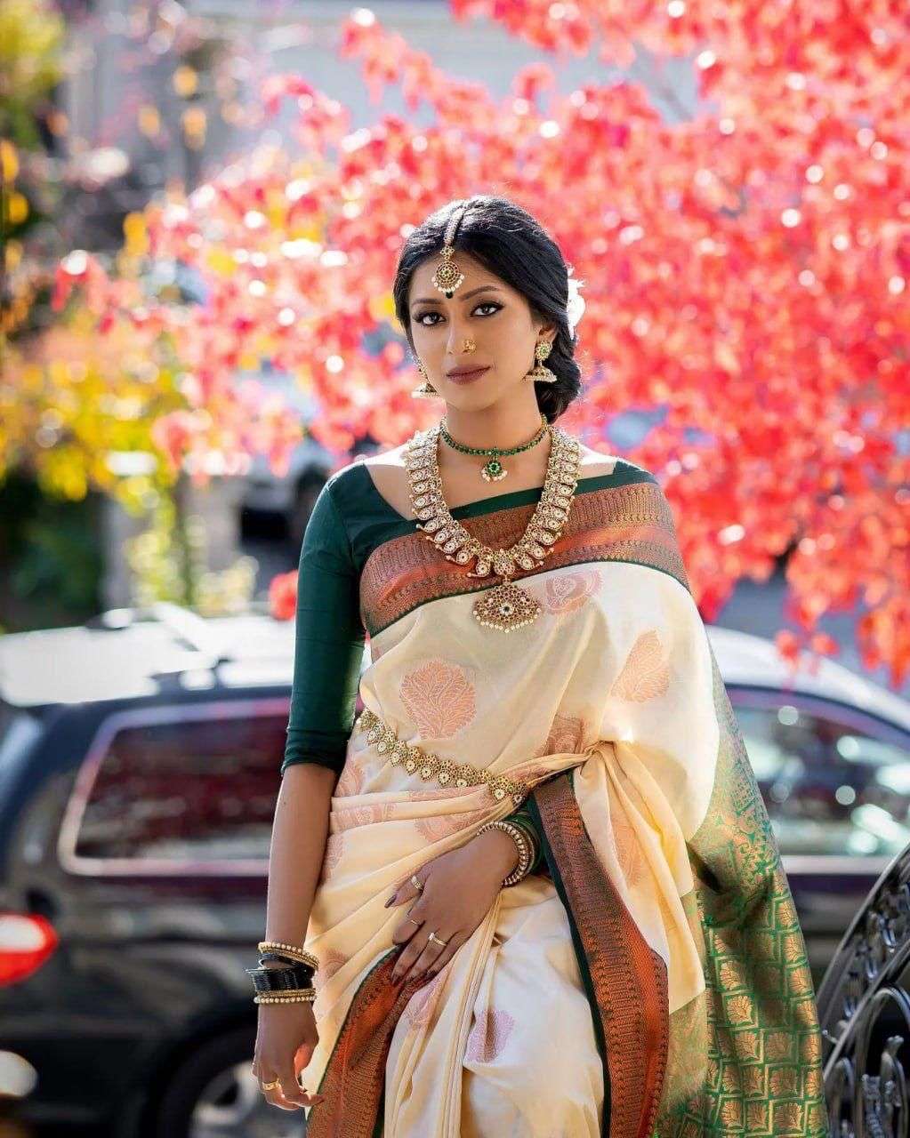 Enchanting Cream Banarasi Silk Saree With Polished Blouse Piece