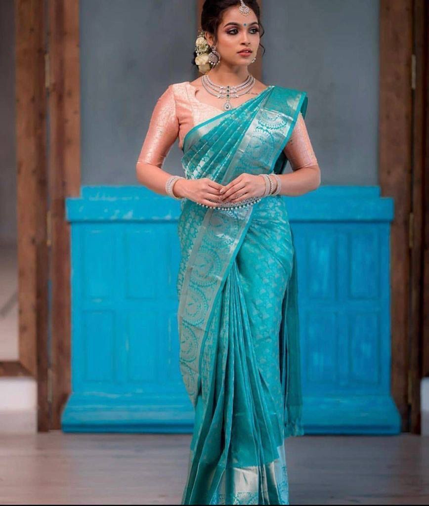 Glamorous Firozi Soft Silk Saree With Gorgeous Blouse Piece