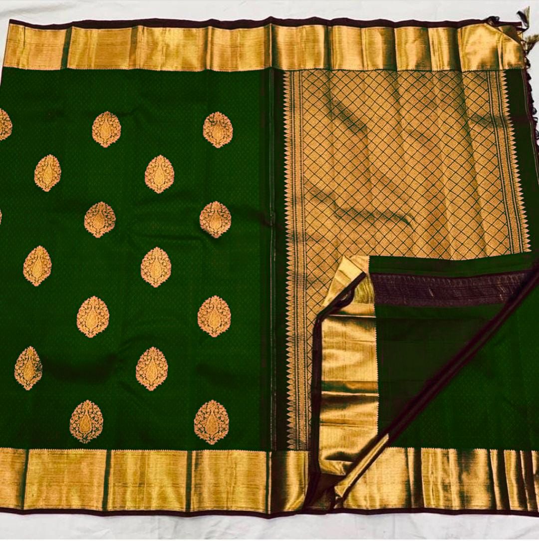 Sublime Dark Green Banarasi Silk Saree With Ornate Blouse Piece