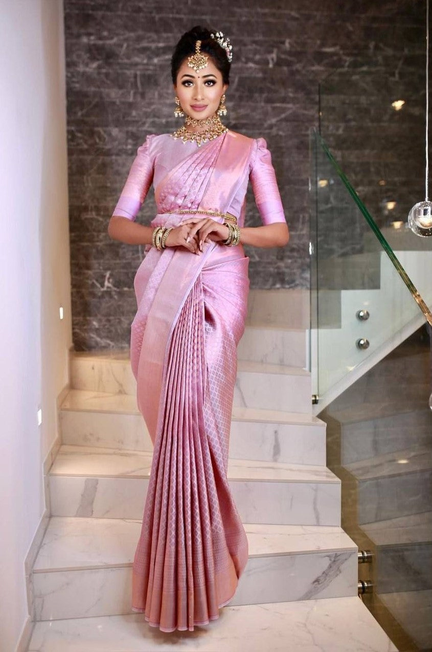 Dazzling Peach Banarasi Silk Saree With Glamorous Blouse Piece