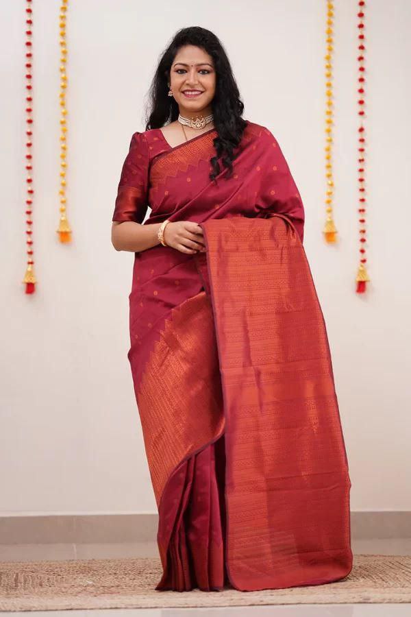 Adorning Maroon Soft Silk Saree With Gossamer Blouse Piece