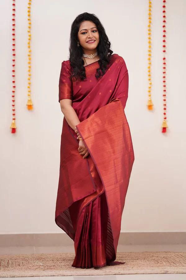 Adorning Maroon Soft Silk Saree With Gossamer Blouse Piece