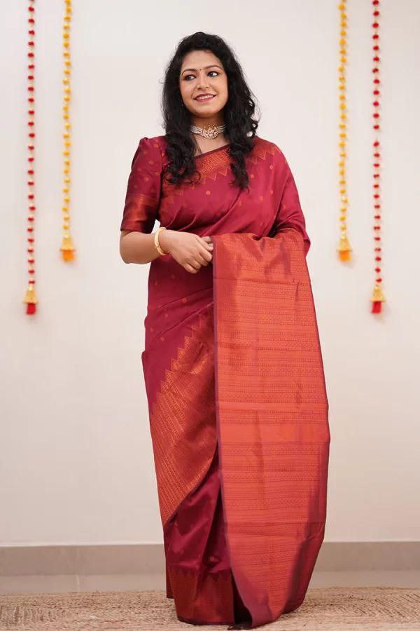 Adorning Maroon Soft Silk Saree With Gossamer Blouse Piece