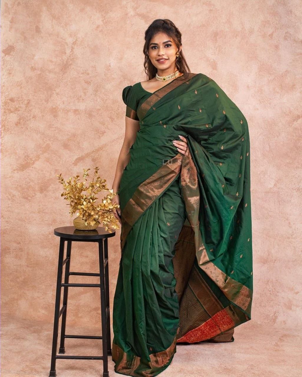 Hypnotic Dark Green Soft Silk Saree With Dreamy Blouse Piece