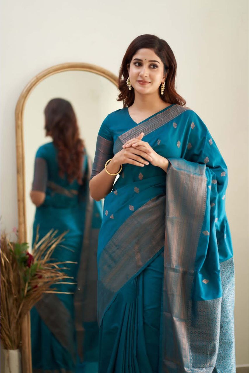 Exceptionally Firozi Soft Silk Saree With Enchanted Blouse Piece
