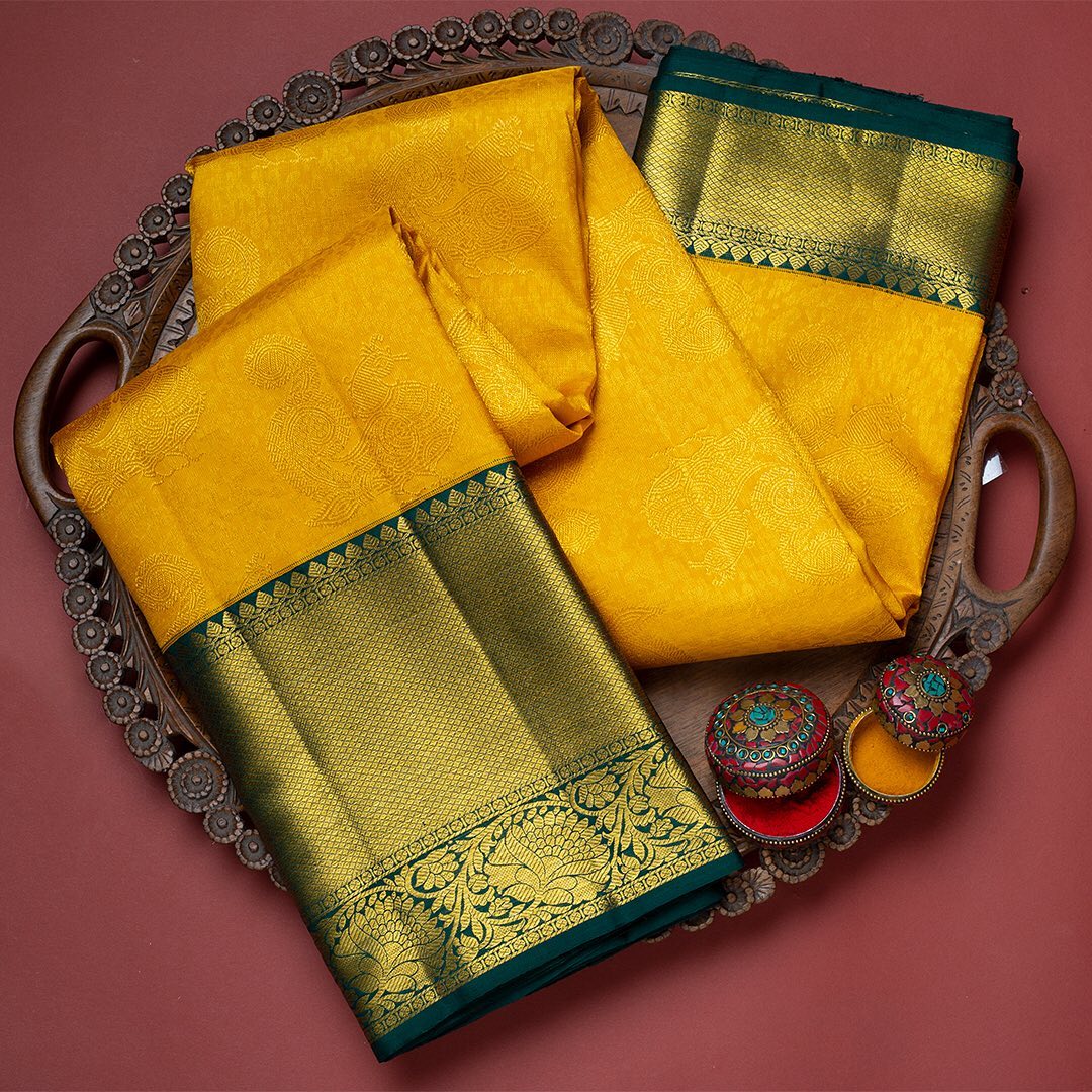 Dazzling Yellow Soft Silk Saree With Two Glistening Blouse Piece