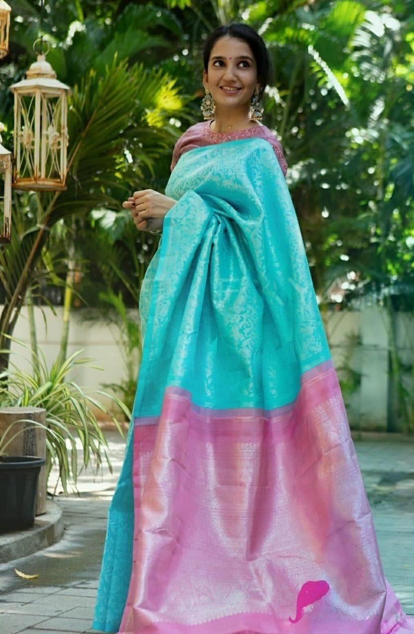 Enveloping Firozi Soft Silk Saree With Lovely Blouse Piece