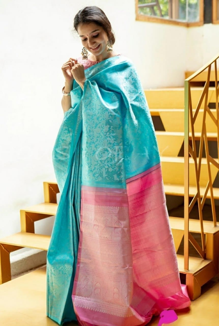 Enveloping Firozi Soft Silk Saree With Lovely Blouse Piece