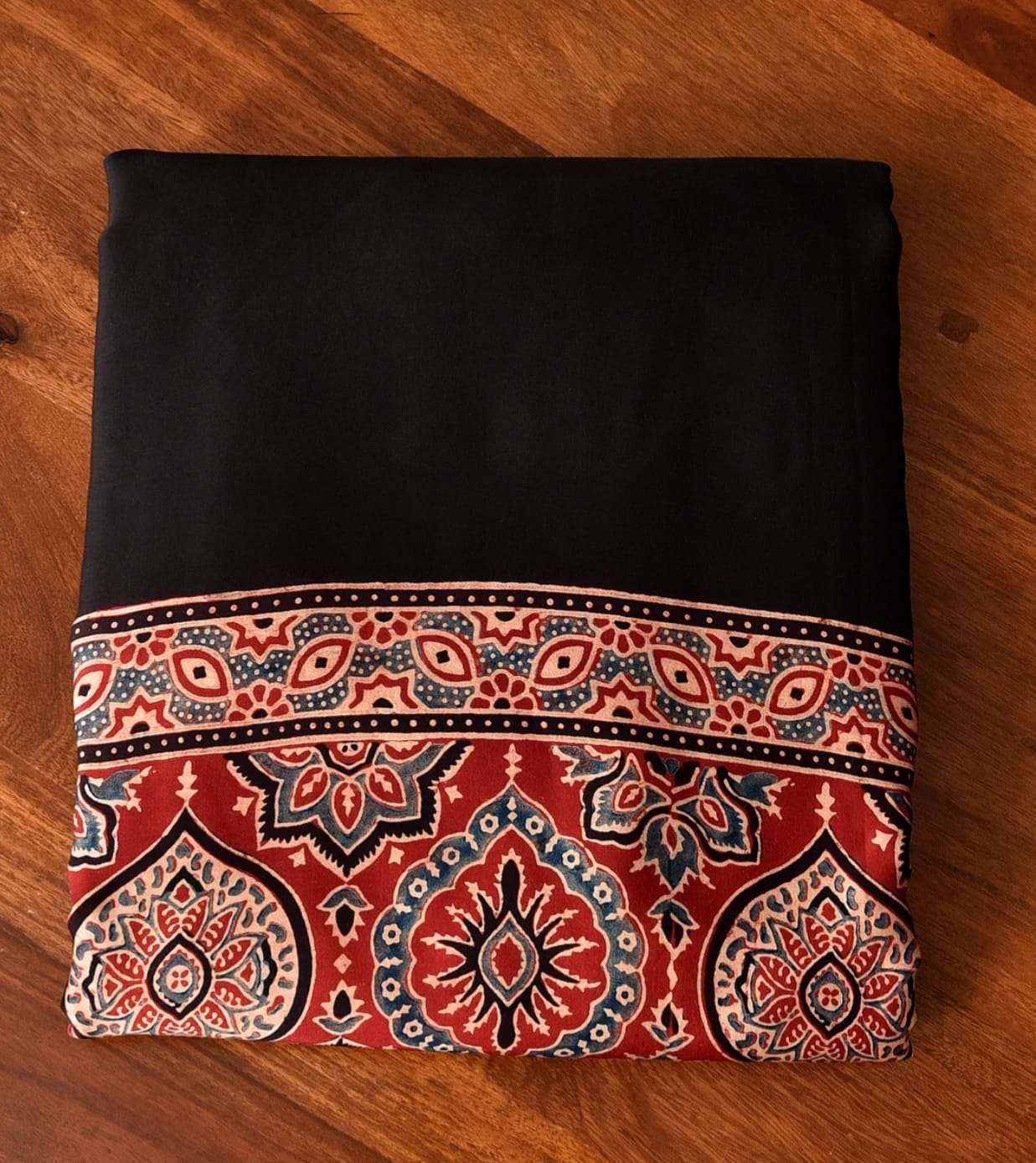 Close-up of premium satin silk Ajrakh print fabric